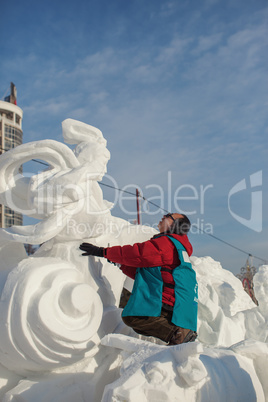 festival "magic ice of siberia", sculptor creates a sculpture f