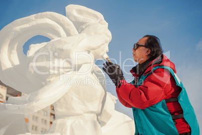 Festival "Magic ice of Siberia", sculptor creates a sculpture f