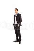 stylish young businessman standing thinking