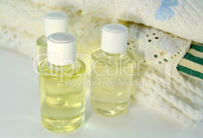 Stack of towels with skin oils