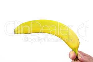 hand holds banana as a gun
