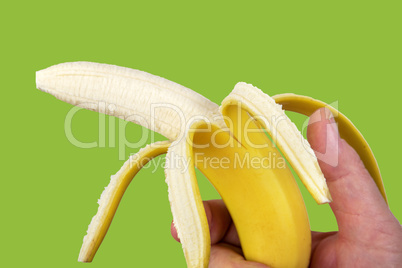 hand holding peeled banana like a gun