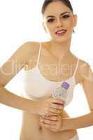 athletic young woman holding bottled water