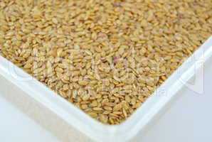 Golden flax seeds on a table