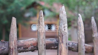 Cabin Behind Rustic Fence