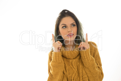 attractive woman pointing to copyspace