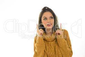 attractive woman pointing to copyspace
