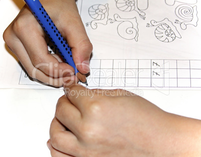 child hand writing word's success