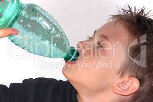 Child drinks water from bottle