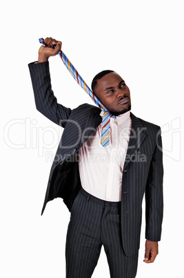 black man pulling his tie.