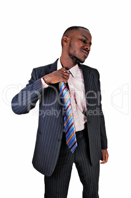 black man taking off tie.