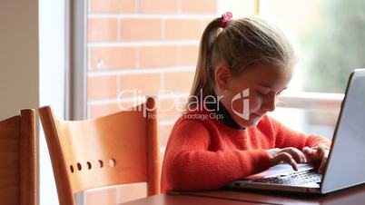 child studying at classroom