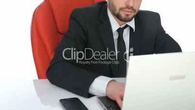 Hardworking businessman sitting at his desk