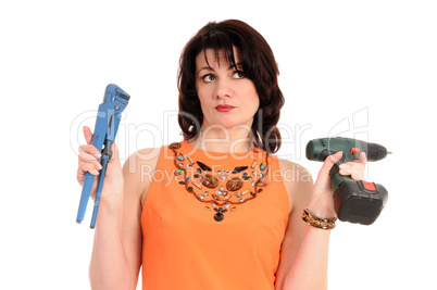 woman with screwdriver andwrench