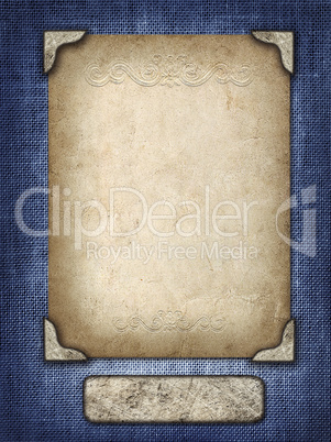 vintage card in a carved frame on fabric background