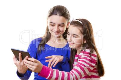 happy teen girls with digital tablet