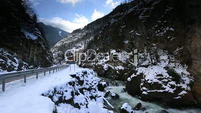 time lapse country road, flowing river and clouds in winter