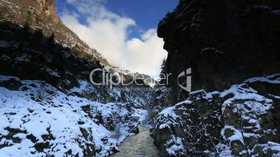 flowing river and clouds in winter