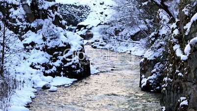 flowing river in winter