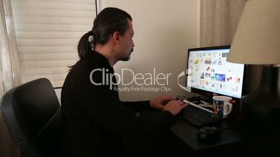 man working computer having backpain