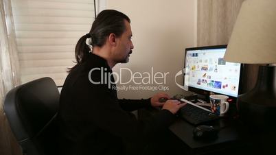 man working computer having neck pain