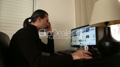 man working computer at home