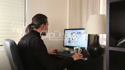 man working computer at home office