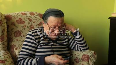 elderly woman talking on the mobile phone