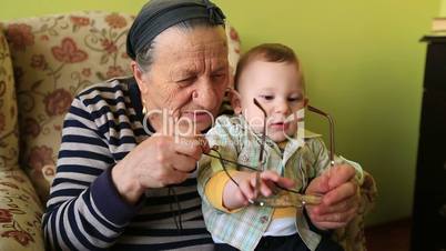 grandmother playing to grandson