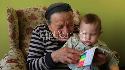 grandmother teaching to grandson