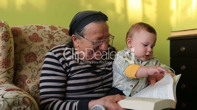 grandmother reading a book to grandson