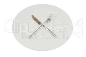 plate with knife and fork on white