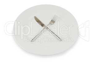 plate with knife and fork on white