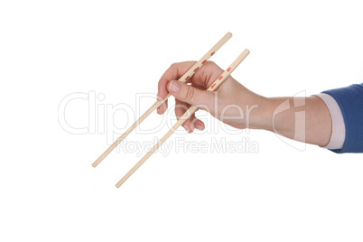 Female hand holding chopsticks with chinese inscription