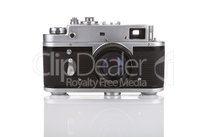 Old manual camera on white background with reflection