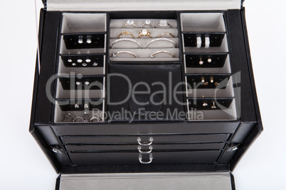 Black leather jewelery box with jewelry inside