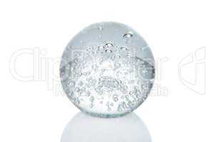 Crystal ball with bubbles and reflection isolated on white