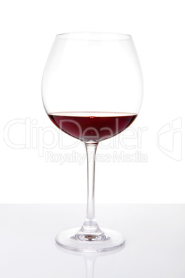 Wine glass with reflection, isolated on white