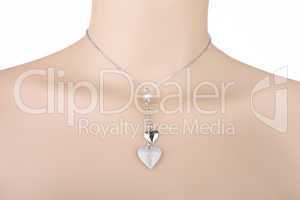 Silver necklace with two heart pendants on a mannequin