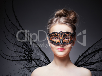 Girl in masquerade mask