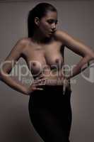 woman posing with bare breasts
