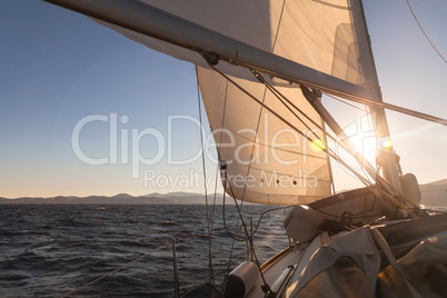 Sailboat at sunset ocean
