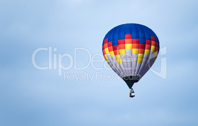 multicolored balloon in the blue sky