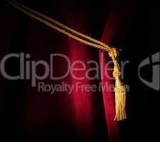 red velvet curtain with tassel