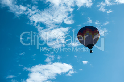 multicolored balloon in the blue sky