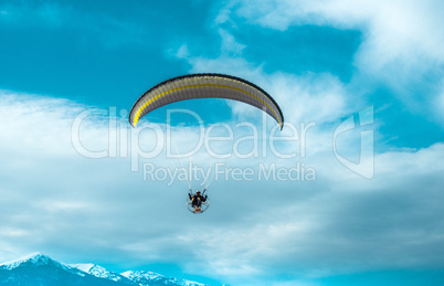 paragliding fly on blue sky