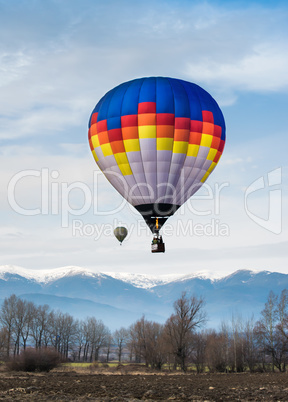 multicolored balloon in the blue sky