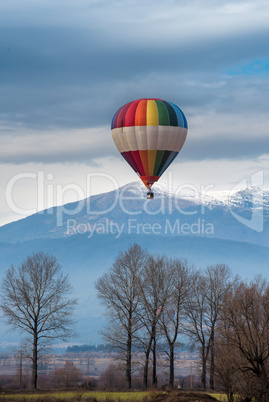 multicolored balloon in the blue sky