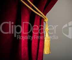 red velvet curtain with tassel