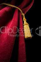 red velvet curtain with tassel